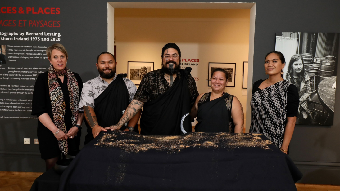 Representatives with sacred Hawaiian objects on a table during a repatriation ceremony in Ulster Museum