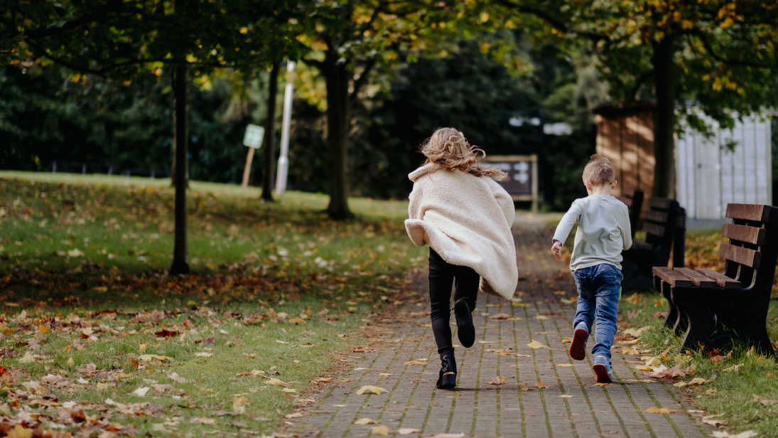 Two children running towards the Ulster Transport Museum