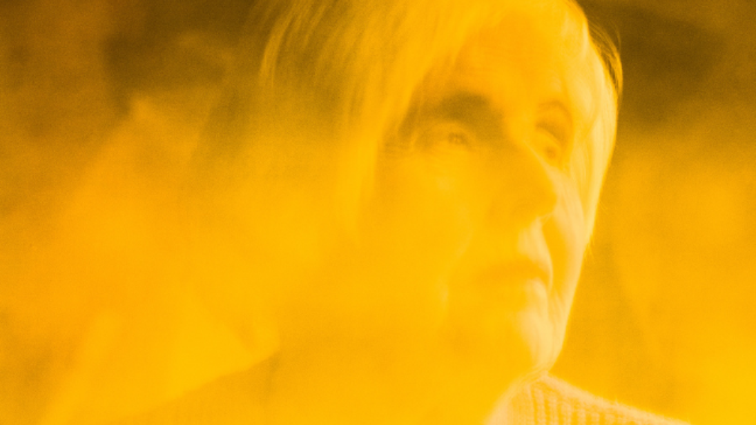 a yellow overwash over a picture of a woman's face