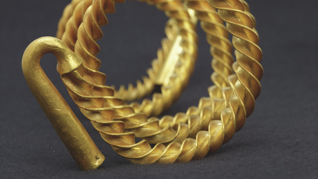 close up of gold rings and a gold hook