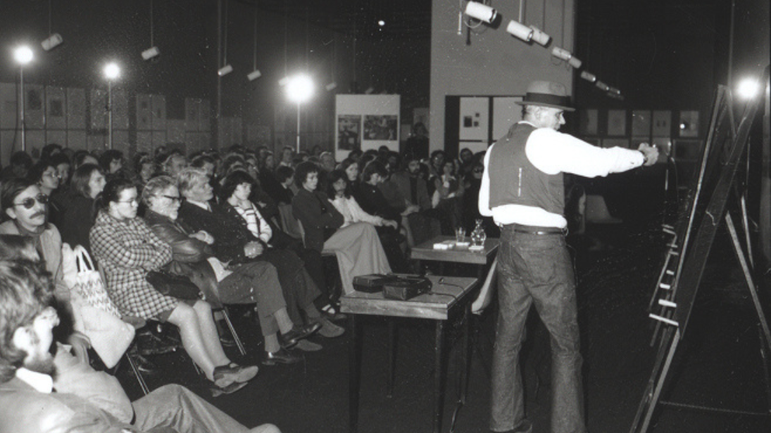 BEUYS 50 Years Later black and white image of beuys giving a lecture to a group of people