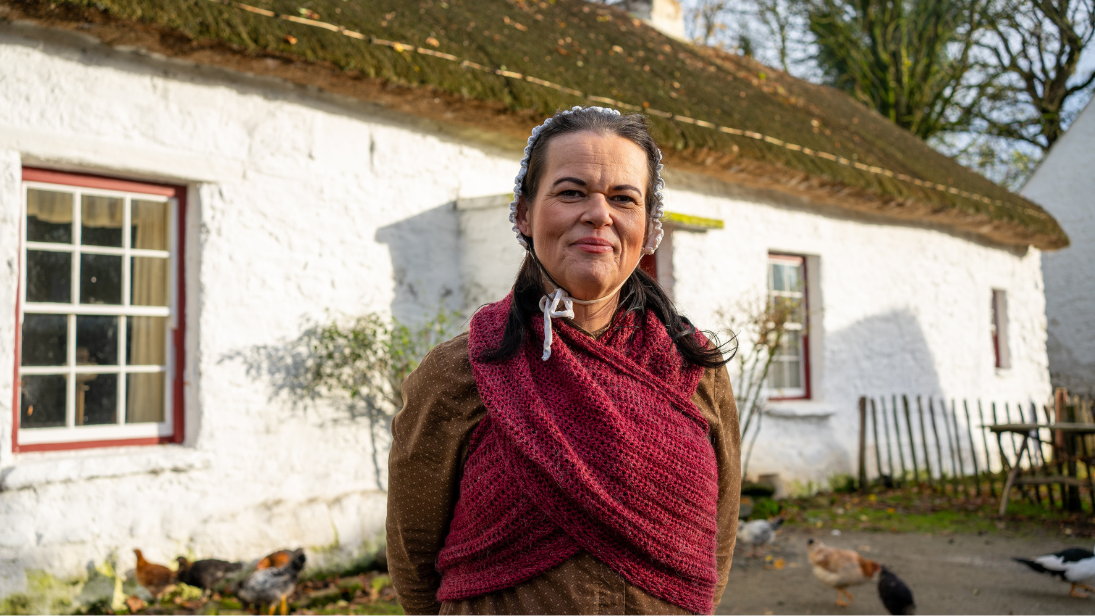 Mrs Mellon outside the Mellon Homestead at the Ulster American Folk Park