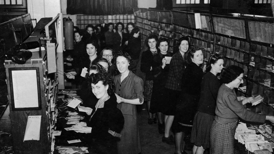 Postwomen in the post sorting office
