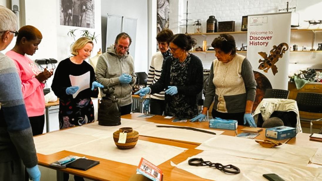 Members of the Causeway Multi Cultural Forum attending the object exploration workshop at Ulster Museum the first of 5 workshops they concluded in November 2022