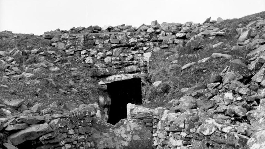 A photograph of the entrance of a cairn.