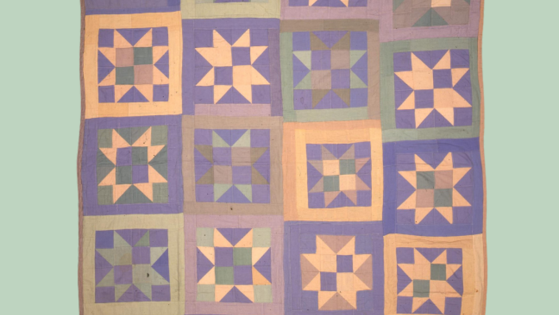 soft pastel coloured patchwork quilt