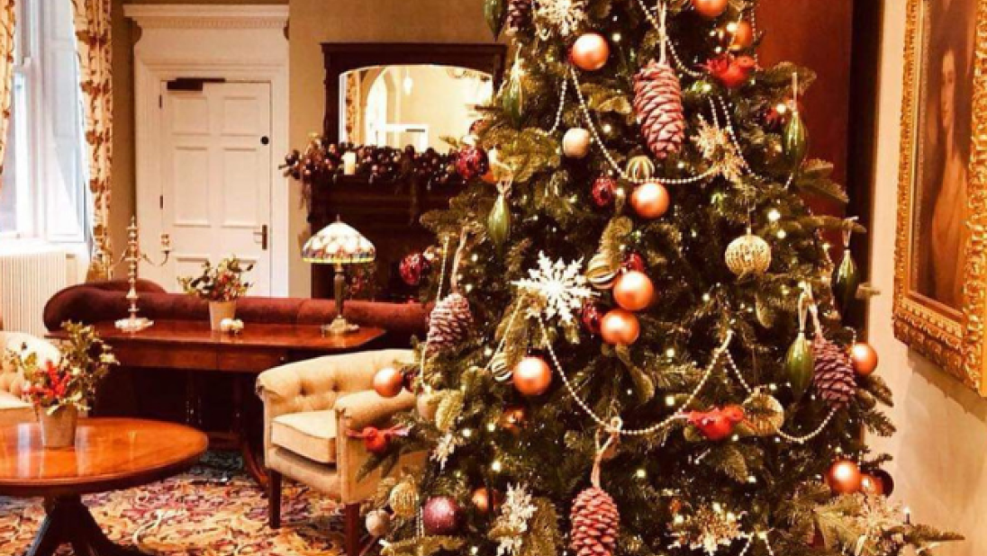 A Christmas tree inside Cultra Manor decorated in red and gold