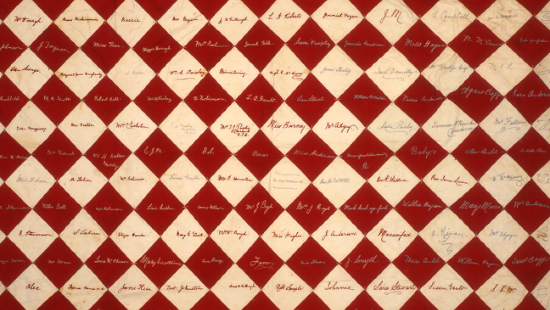 A red and white patchwork quilt.