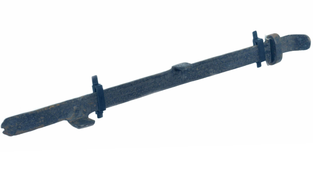 A long metal object that connects to a plough.