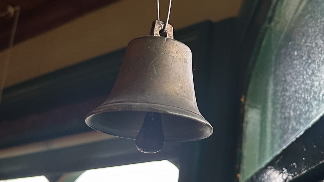 A bell above a shop door.