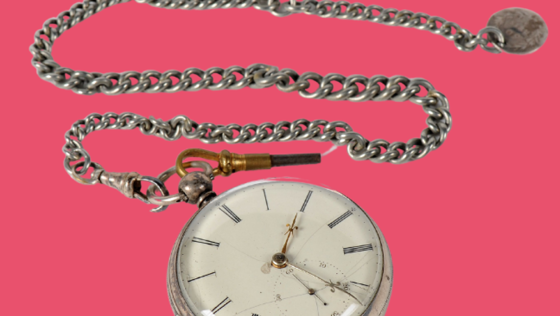 Pocket watch and chain, silver, on a pink background