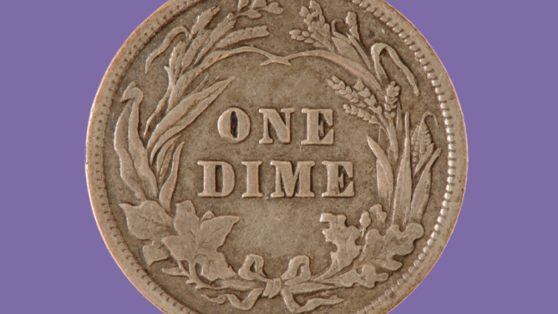 One dime coin on a purple background