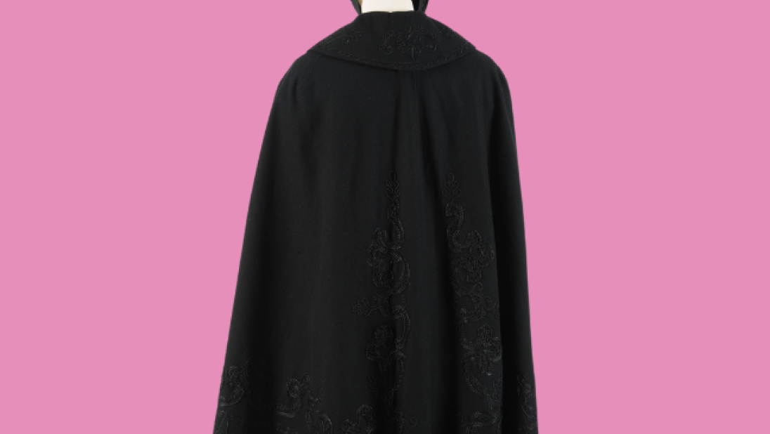 Black cape on a pink background