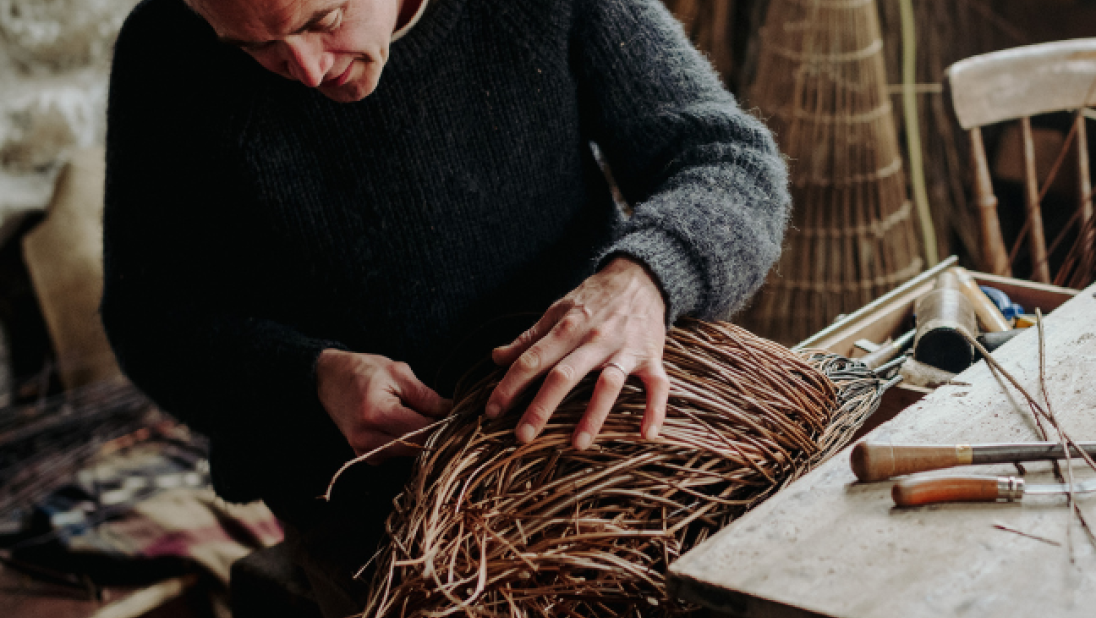 Man doing weaving at the folk museum 