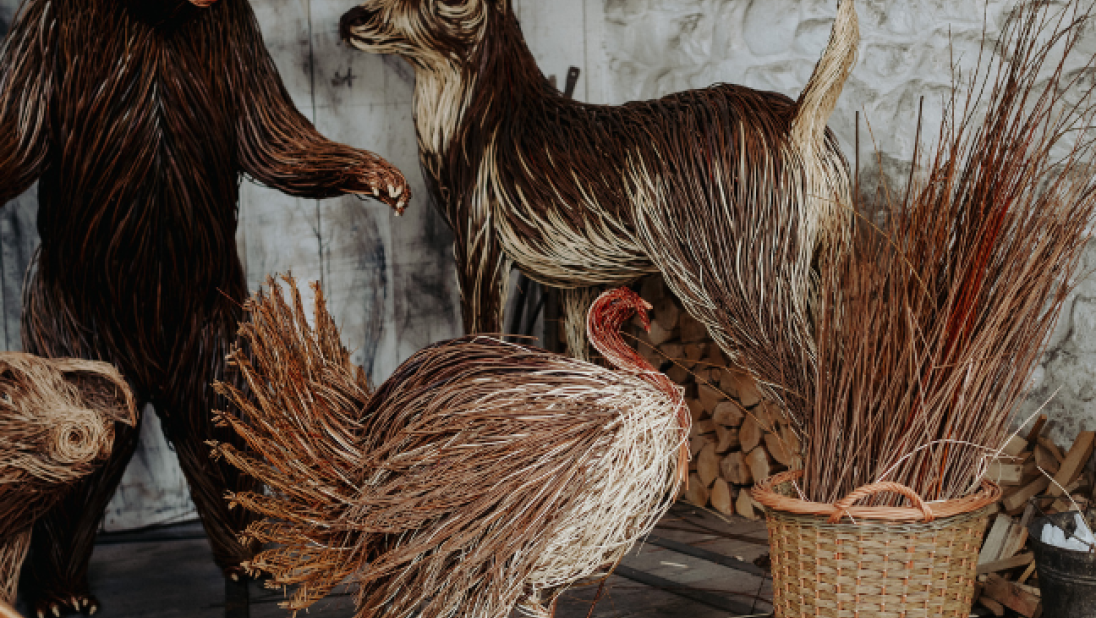 a bear, chicken and deer made out of woven willow materials