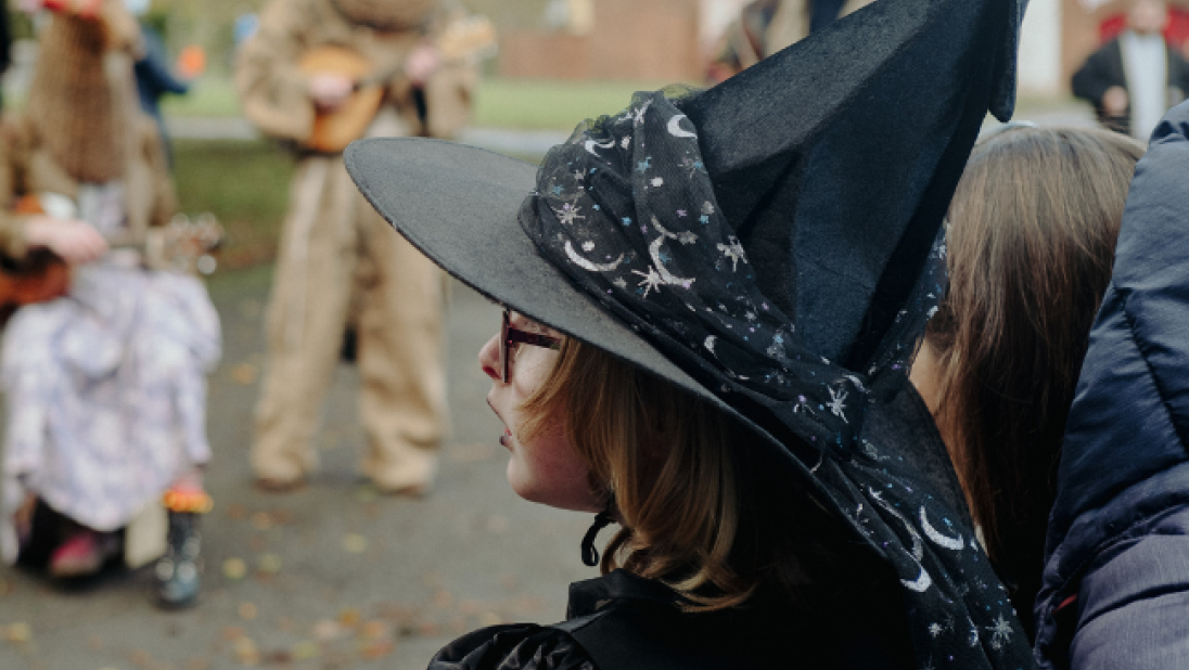 A child dressed as a witch