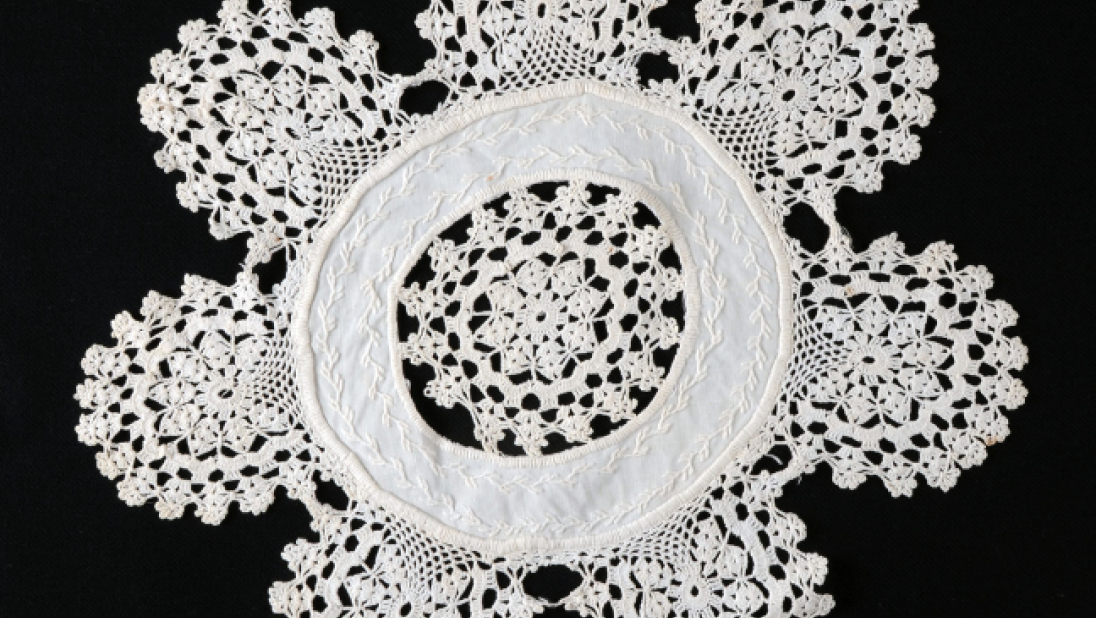 A crochet lace doily, with lots of small links.