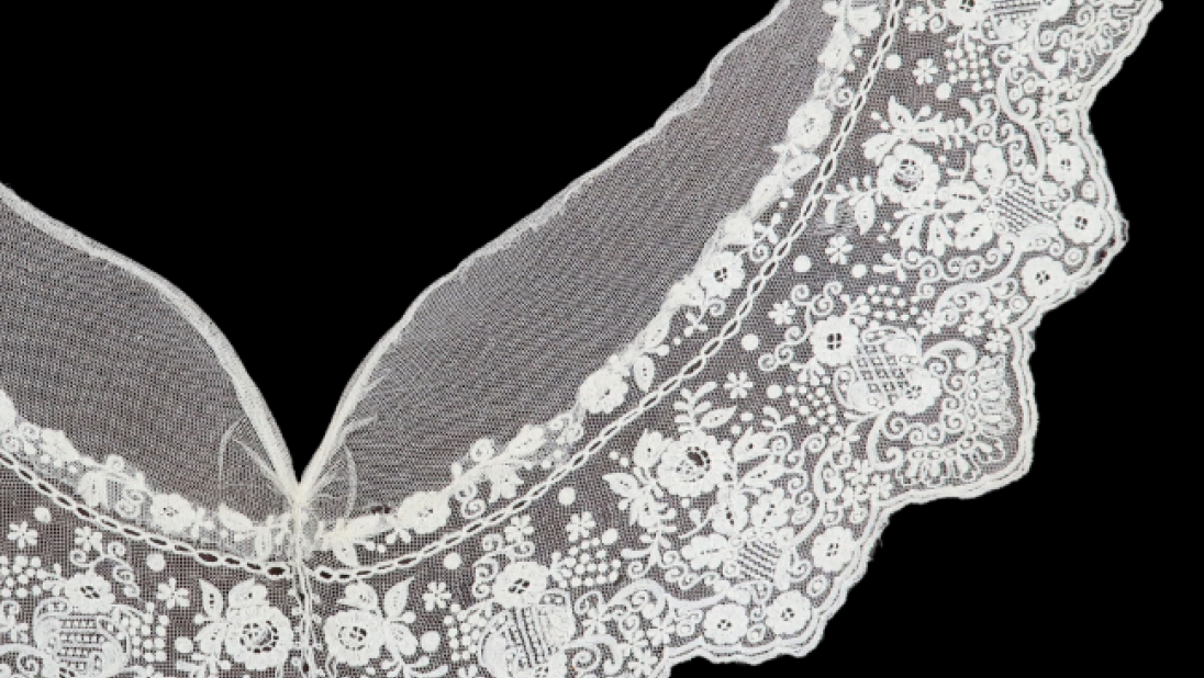 A v-shaped collar with intricate floral designs.