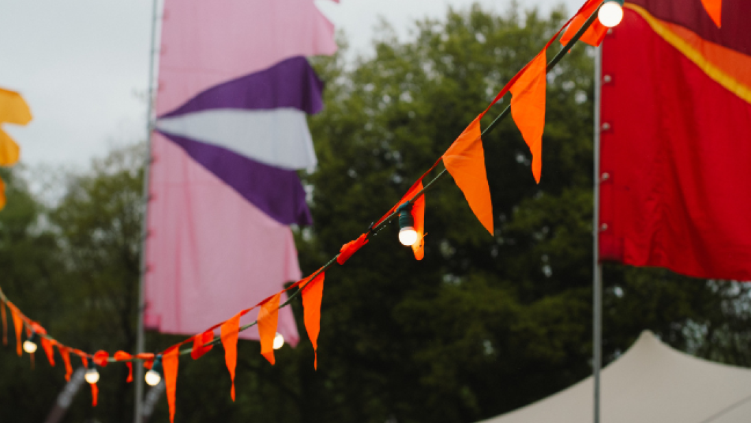 festival flags in orange pink and red