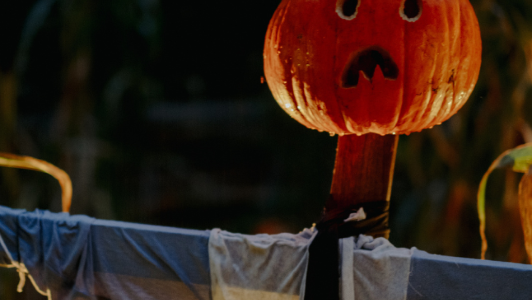 a sad face pumpkin scarecrow 