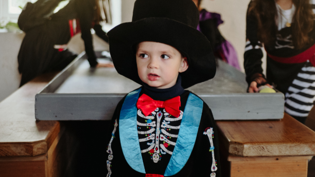 A child dressed in costume at halloween