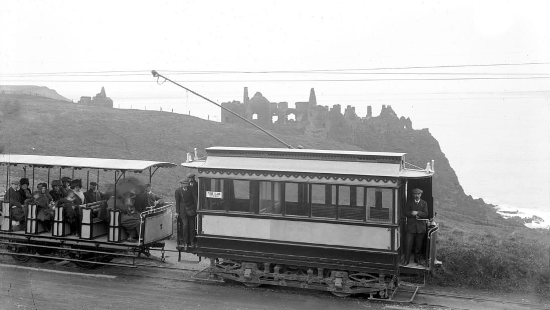 A black and white photograph on its route. In the background, you can see the ruins of an old castle. 