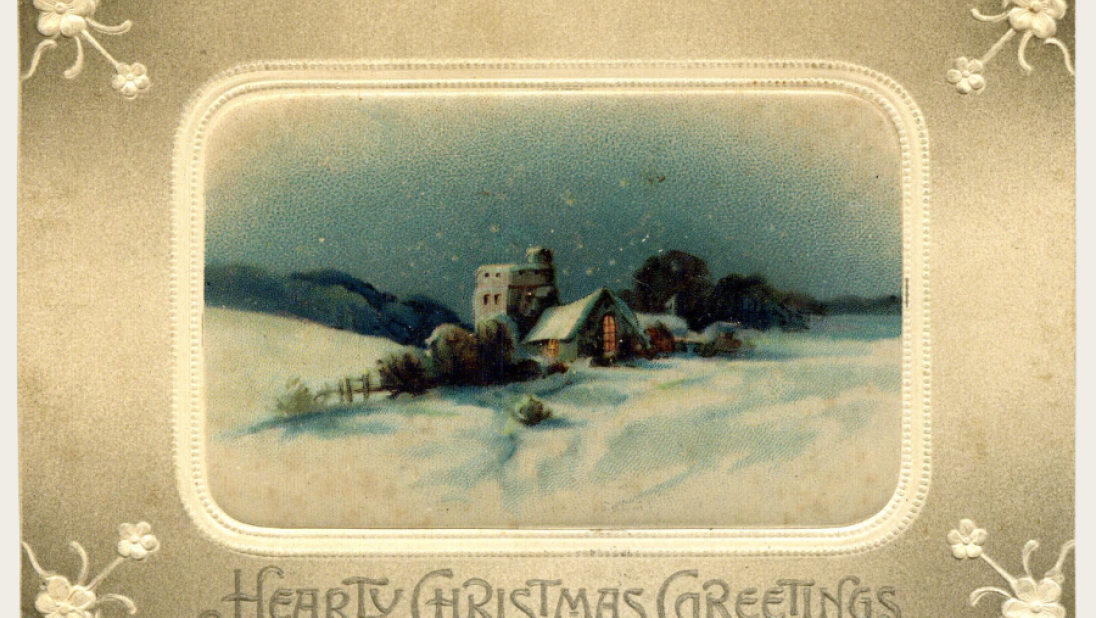 A Christmas postcard of a town decked in snow.