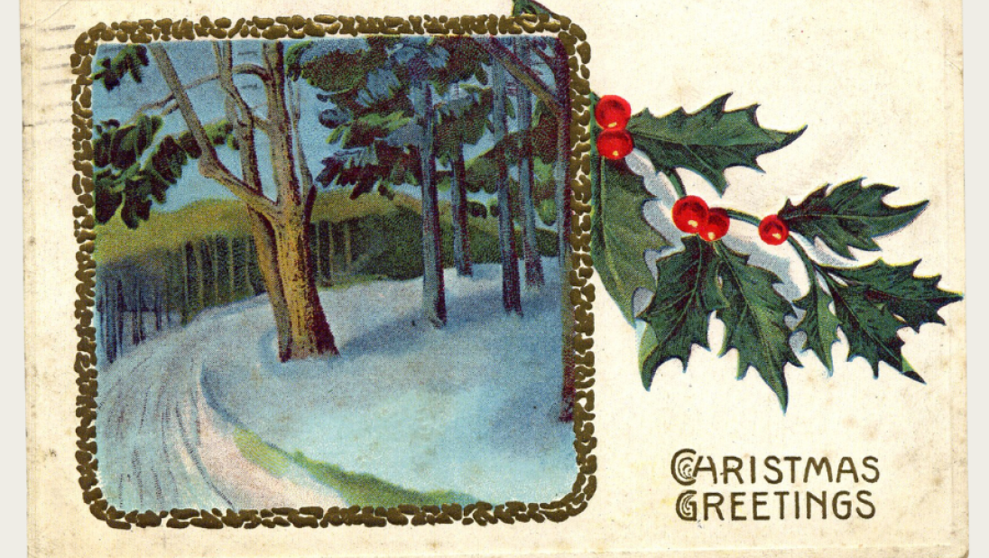 A Christmas postcard of a snowy forest lane.