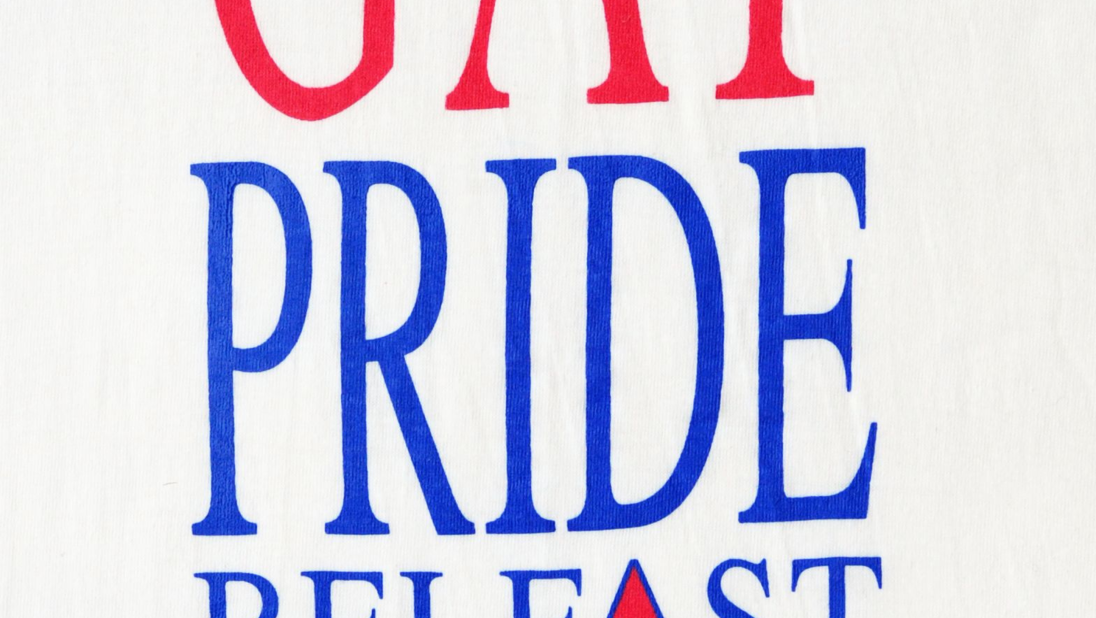 A close up of a tshirt logo reading 'Gay Pride Belfast 1991'.