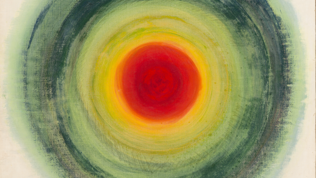 An abstract painting. In a target pattern, circles of blue, then green, then yellow, then red at the centre, have been painted.