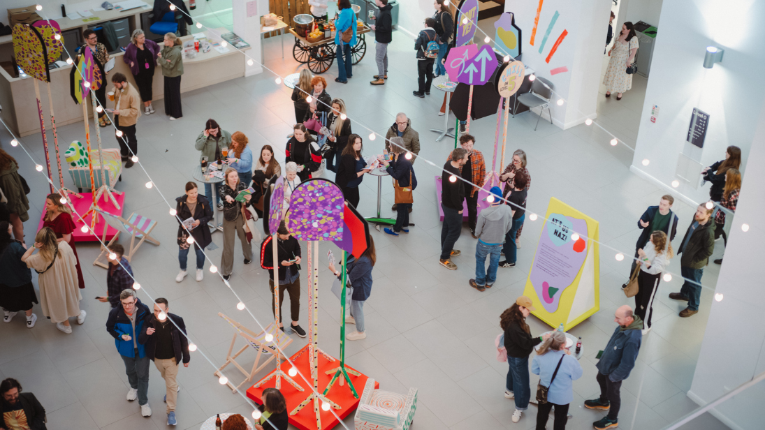 People standing and chatting in the Ulster Museum atrium