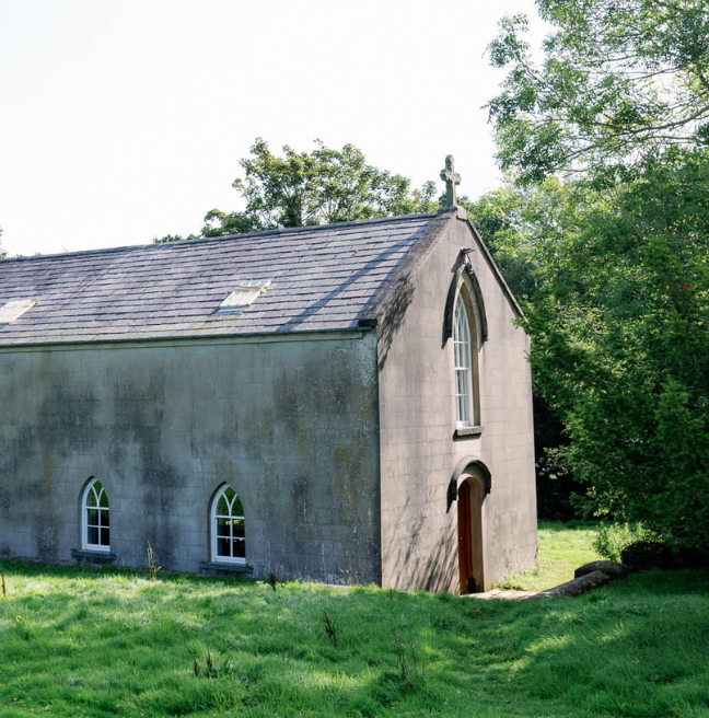 A long church with a crucifix above the door.