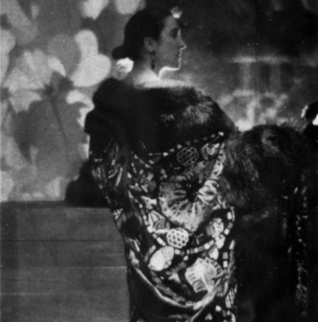 Black and White photo of a lady wearing an Opera Cloak