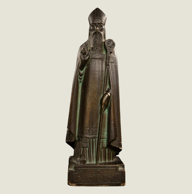 Sculpture of St.Patrick by John Luke on a beige background