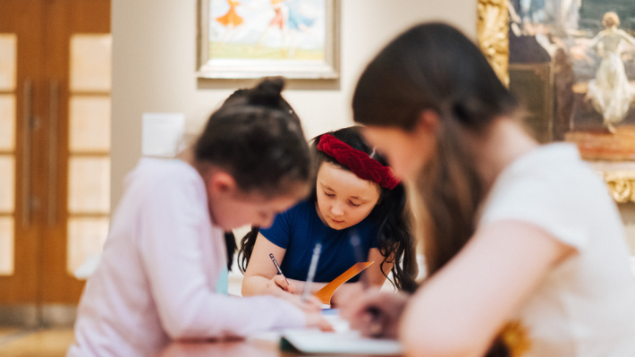 four girls drawing pictures in Ulster Museum art galleries