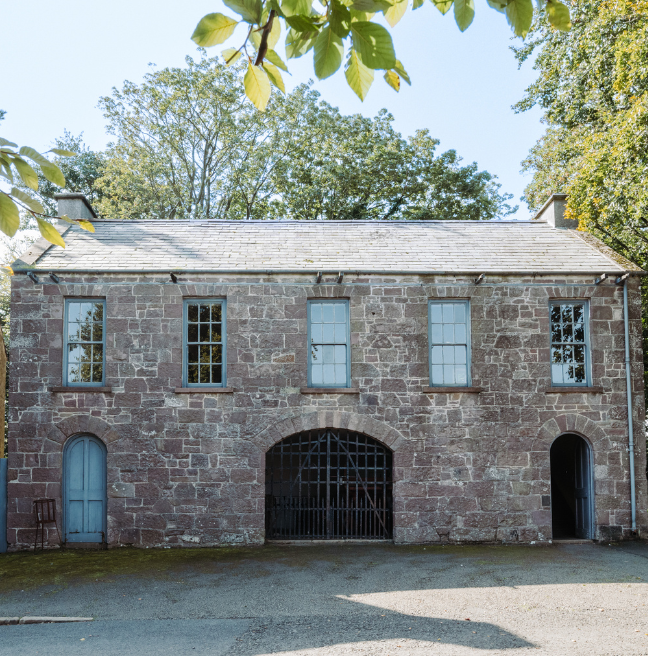 A large stone building with an arched entryway.