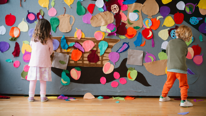 Two young children playing in Discover Art 