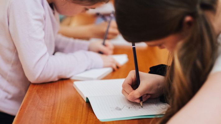 two children drawing pictures