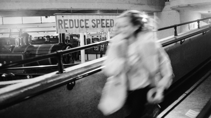 A black and white image of a girl in the ulster transport museum