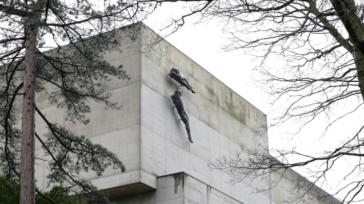 Two grey aluminium sculptures on the façade of Ulster Museum
