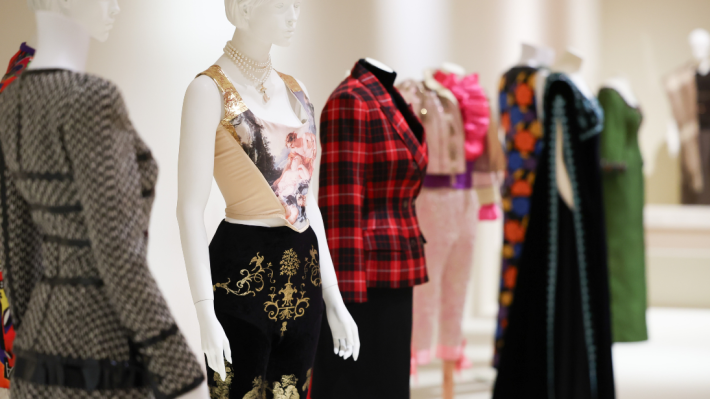 four model dummys with different outfits on from ashes to fashion exhibition 
