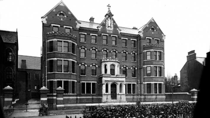 A black and white photo of the Mater Hospital in Belfast, in grand looking brick building.