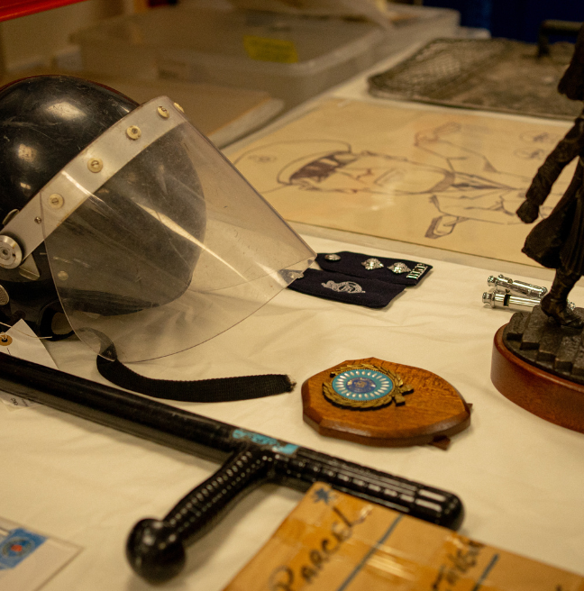 Table with objects from the Prison Service Collection