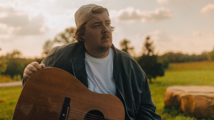 Musician, Gareth, with a guitar