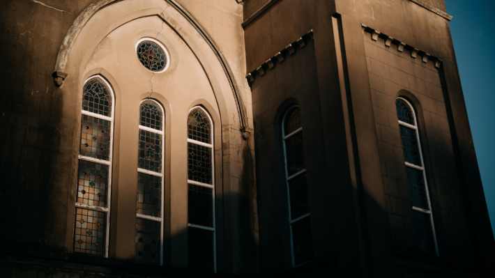 An image of a church with a shadow over it