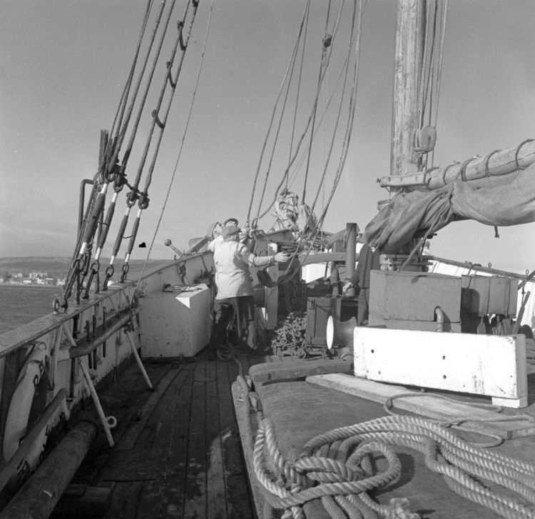 Black and white photograph of crew working on deck on the Result