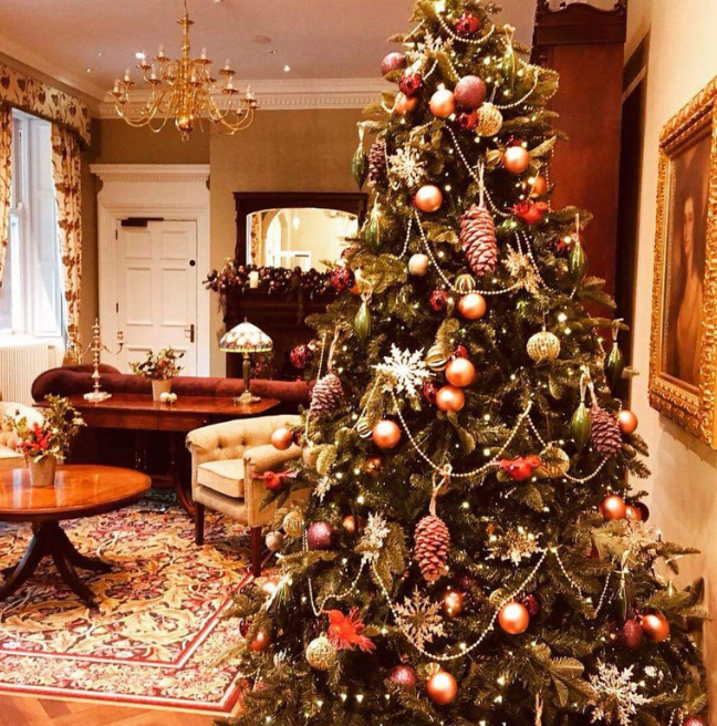 A Christmas tree inside Cultra Manor decorated in red and gold