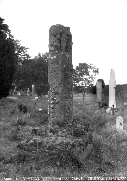 An image of a tall standing stone that has been carved with celtic imagery.