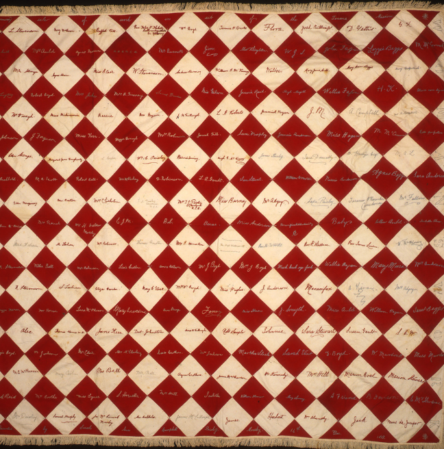 A red and white patchwork quilt.