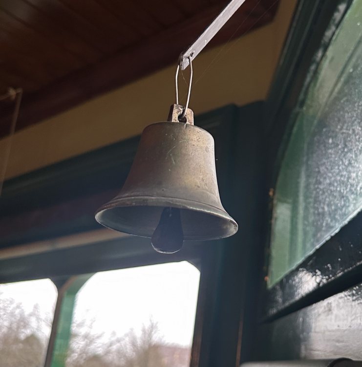 A bell above a shop door.
